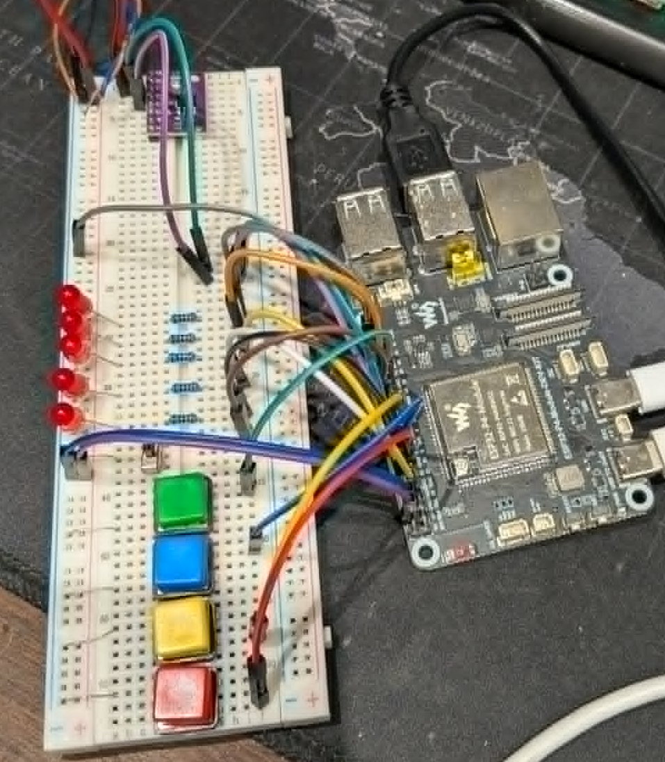 ESP32-P4 dev kit wired to a breadboard with buttons, LEDs, and a CAN transceiver for prototyping PDMKit logic